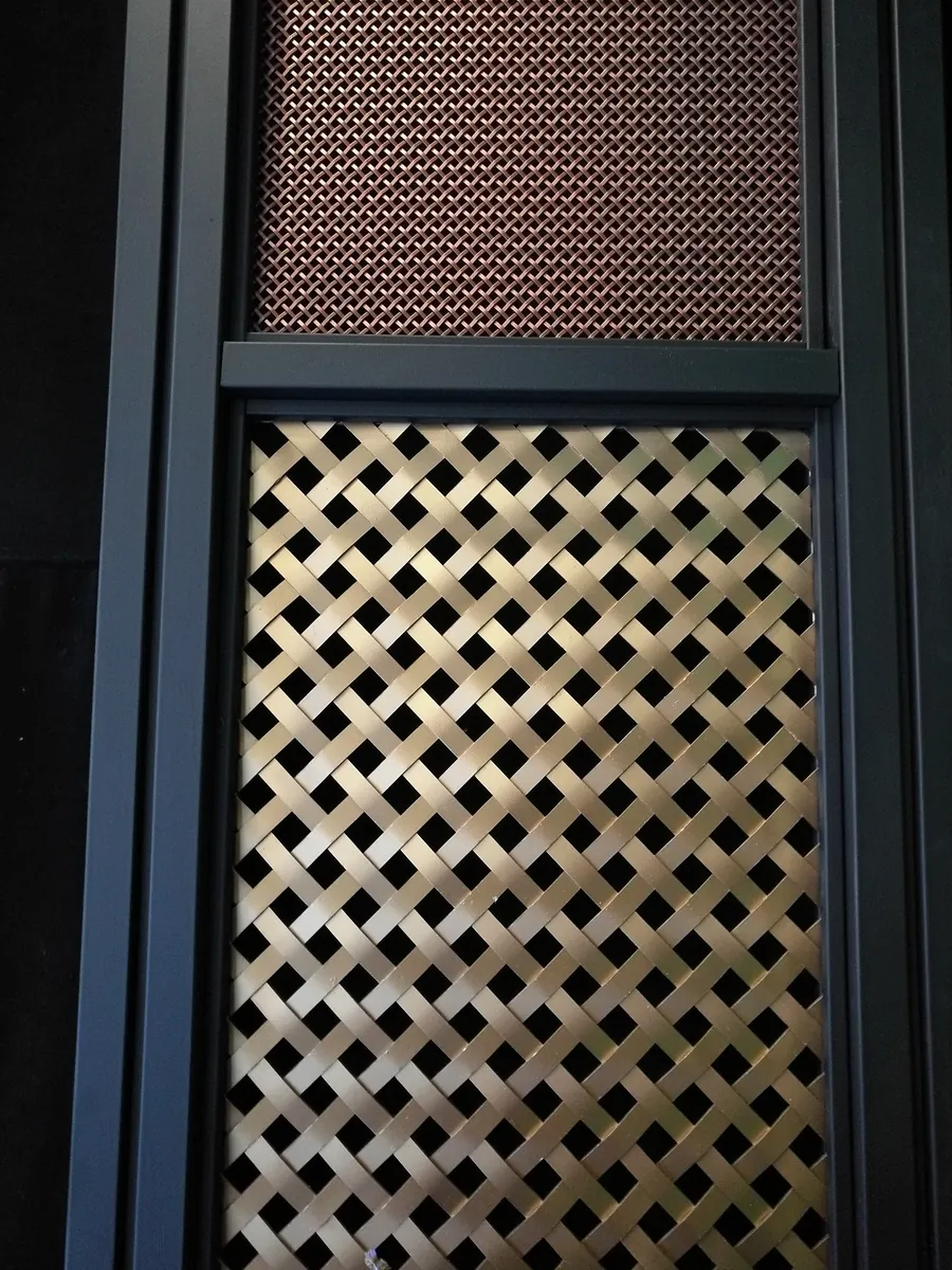 Two woven metal surfaces in a frame shown as a decorative application reference