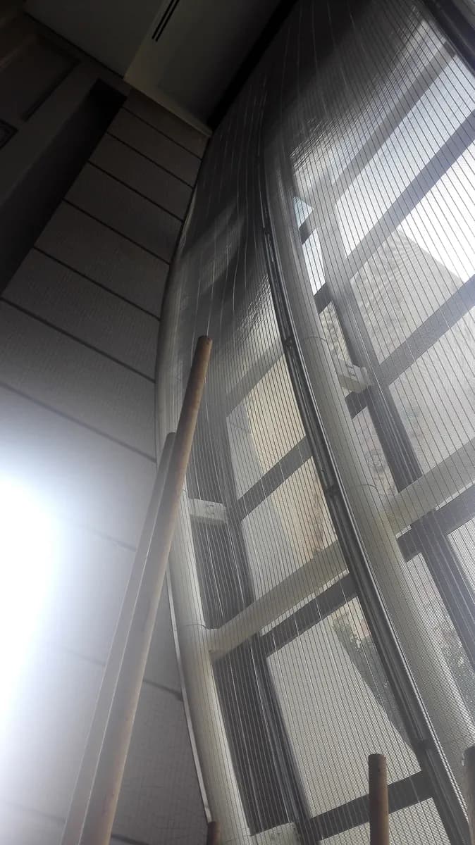Tall interior mesh screen shown as a generic application context reference