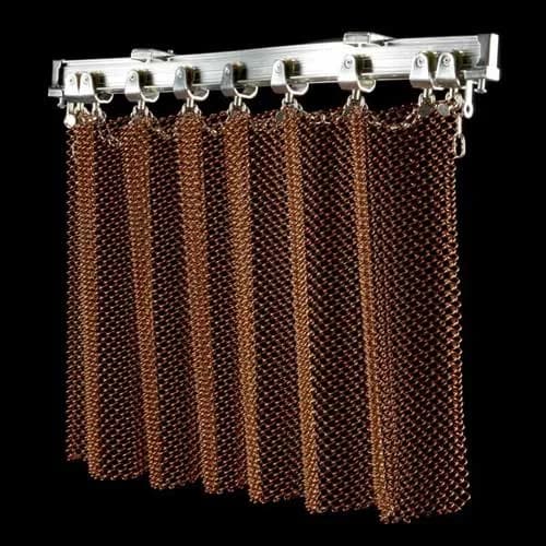 Coil mesh hanging from carriers on a track, shown as a suspension reference