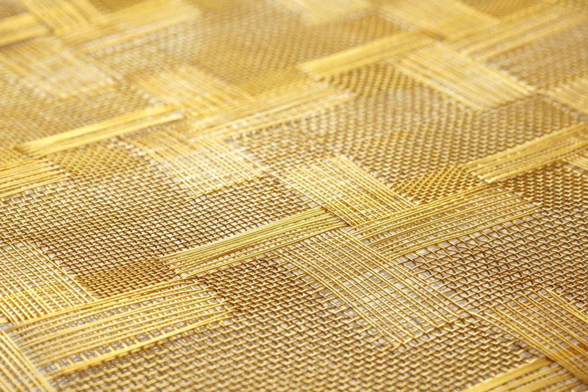 JA-Y010 gold-finish rigid metal mesh sample showing colour, structure and edge detail
