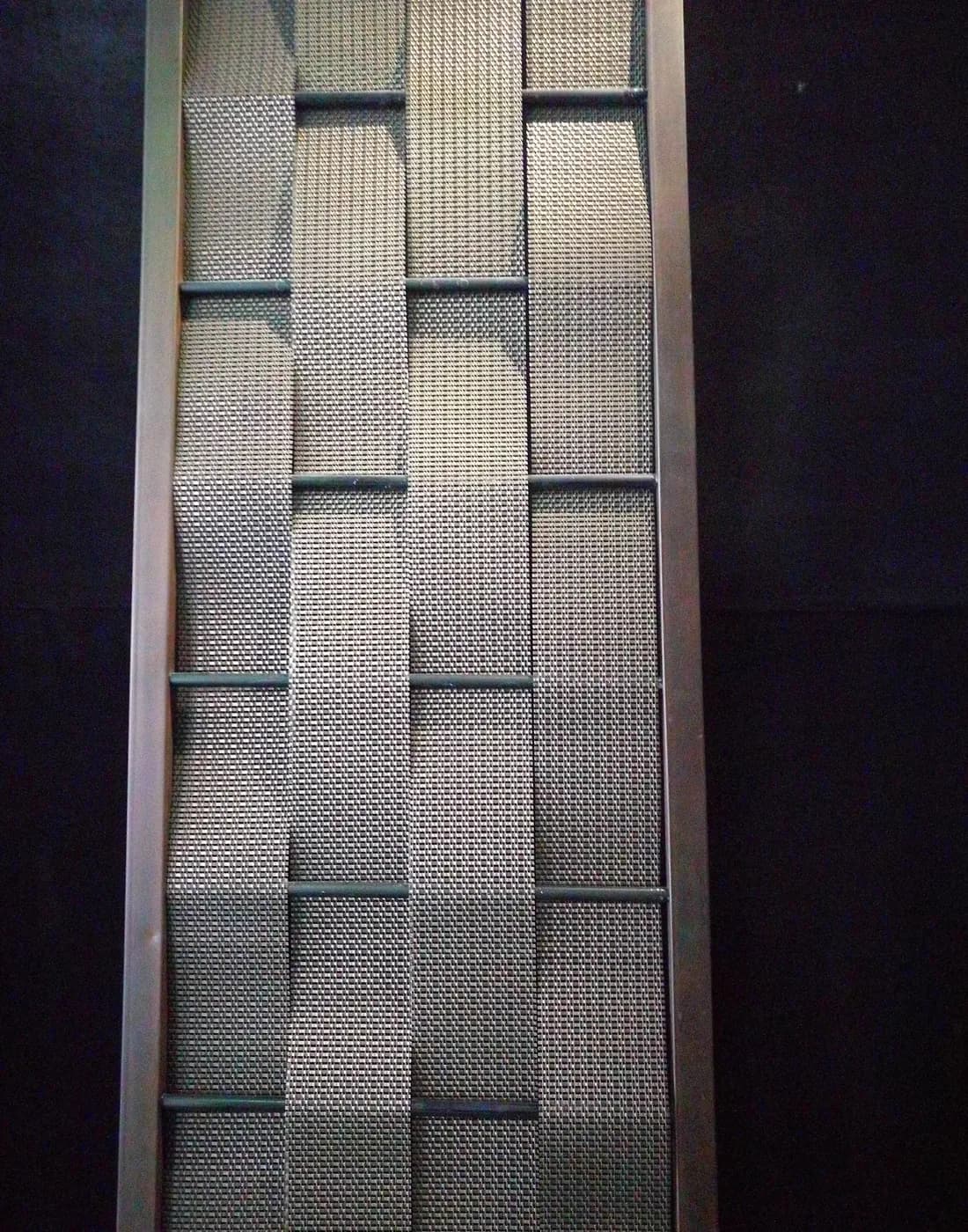 Architectural metal mesh close-up showing wire dimensions, opening geometry and orientation