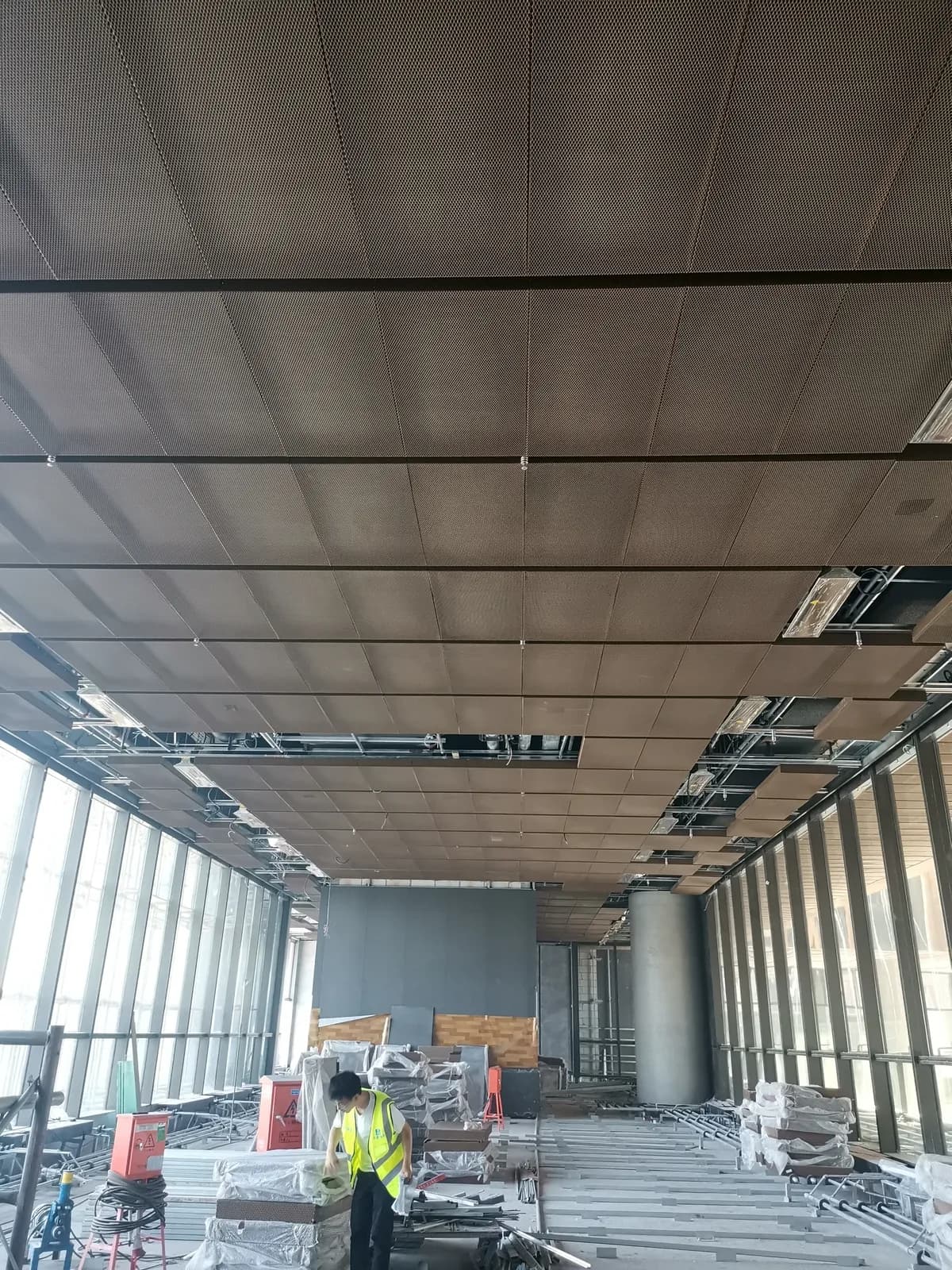 Architectural metal mesh ceiling context showing joints, access and supporting-interface coordination