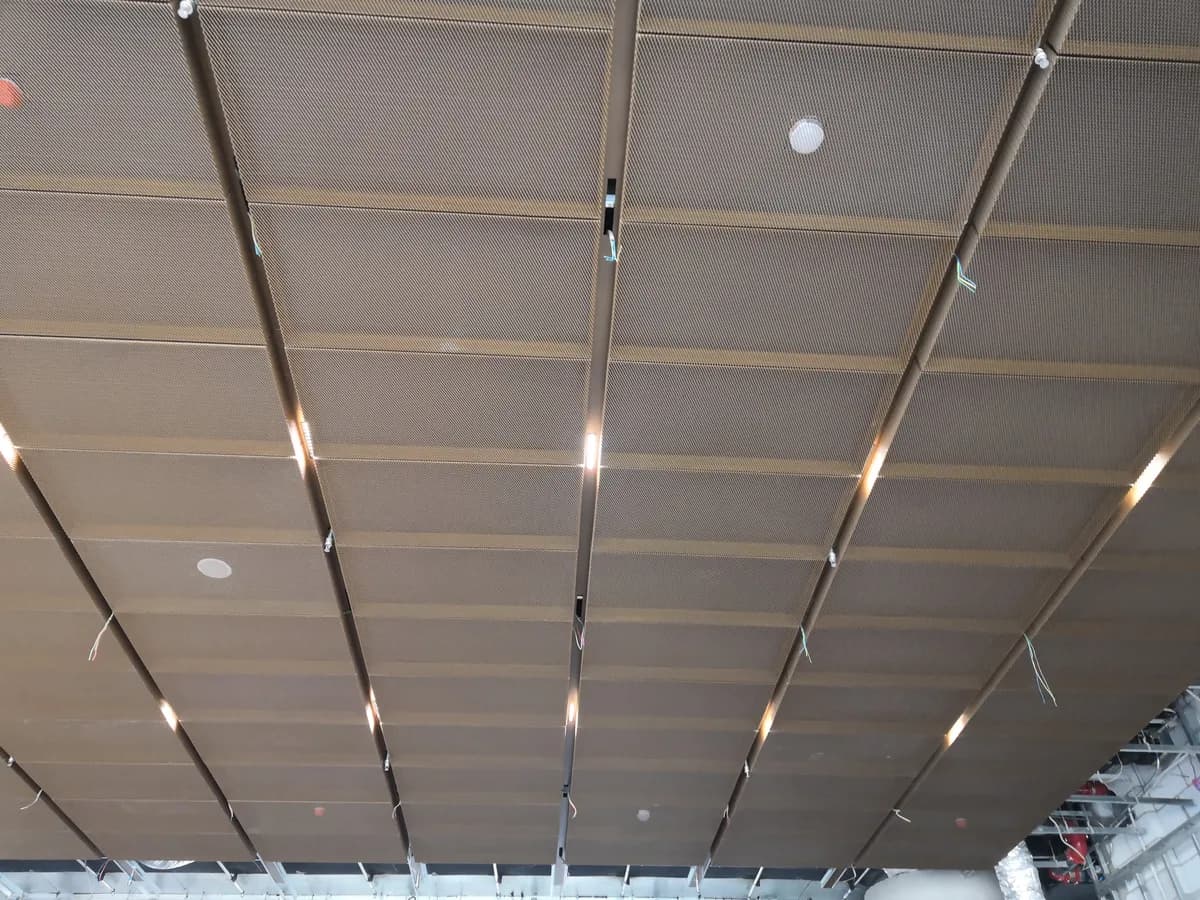 Architectural metal mesh ceiling detail and suspension context