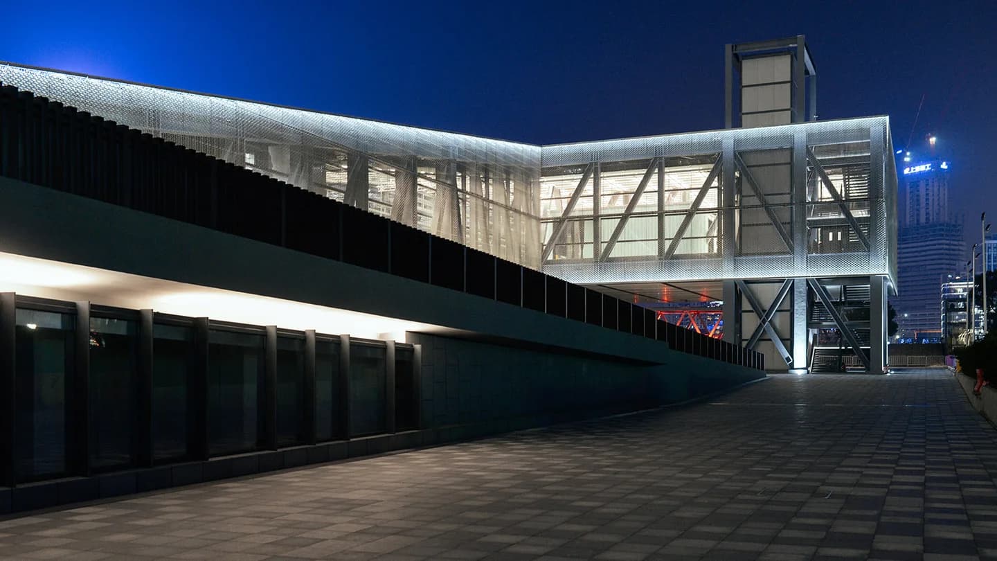 Shanghai Shipyard connecting walkway and facade mesh in an evening archive view